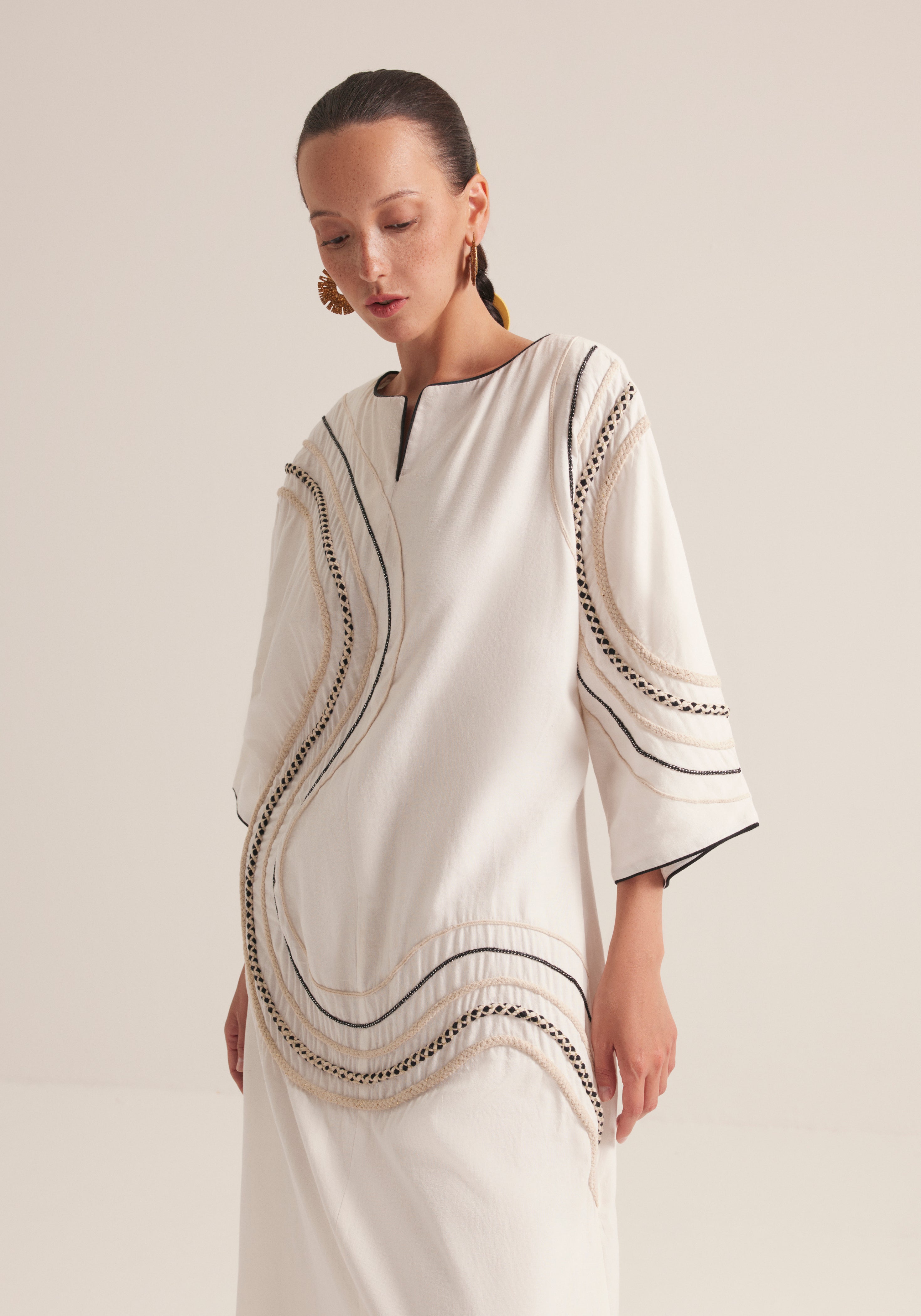 Off white Kaftan with traffic swirls of embroidery
