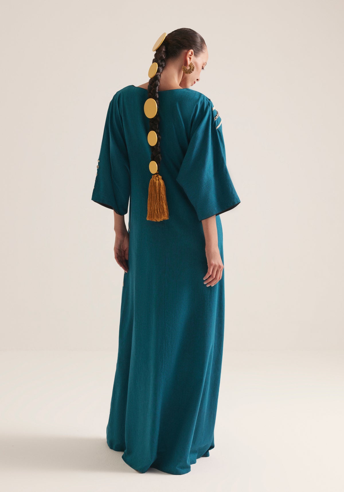 Teal Kaftan with graphic swirls of embroidery
