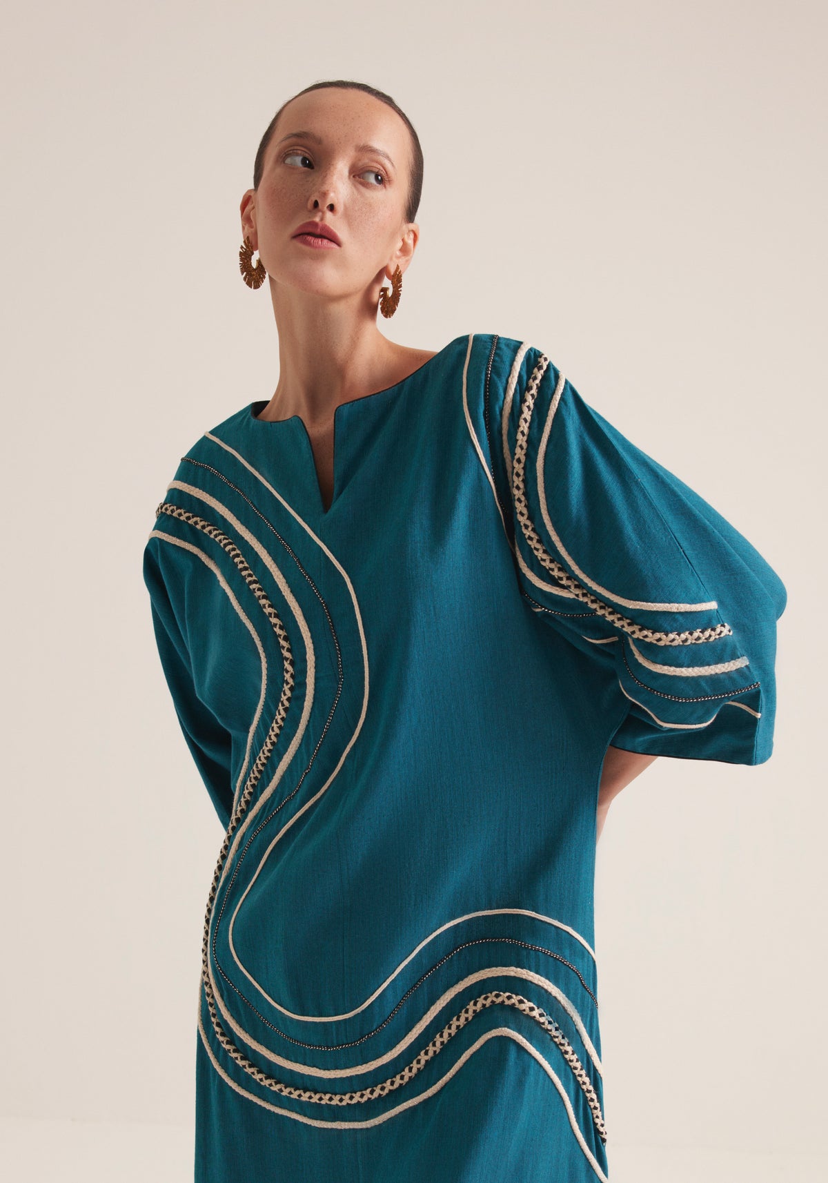 Teal Kaftan with graphic swirls of embroidery