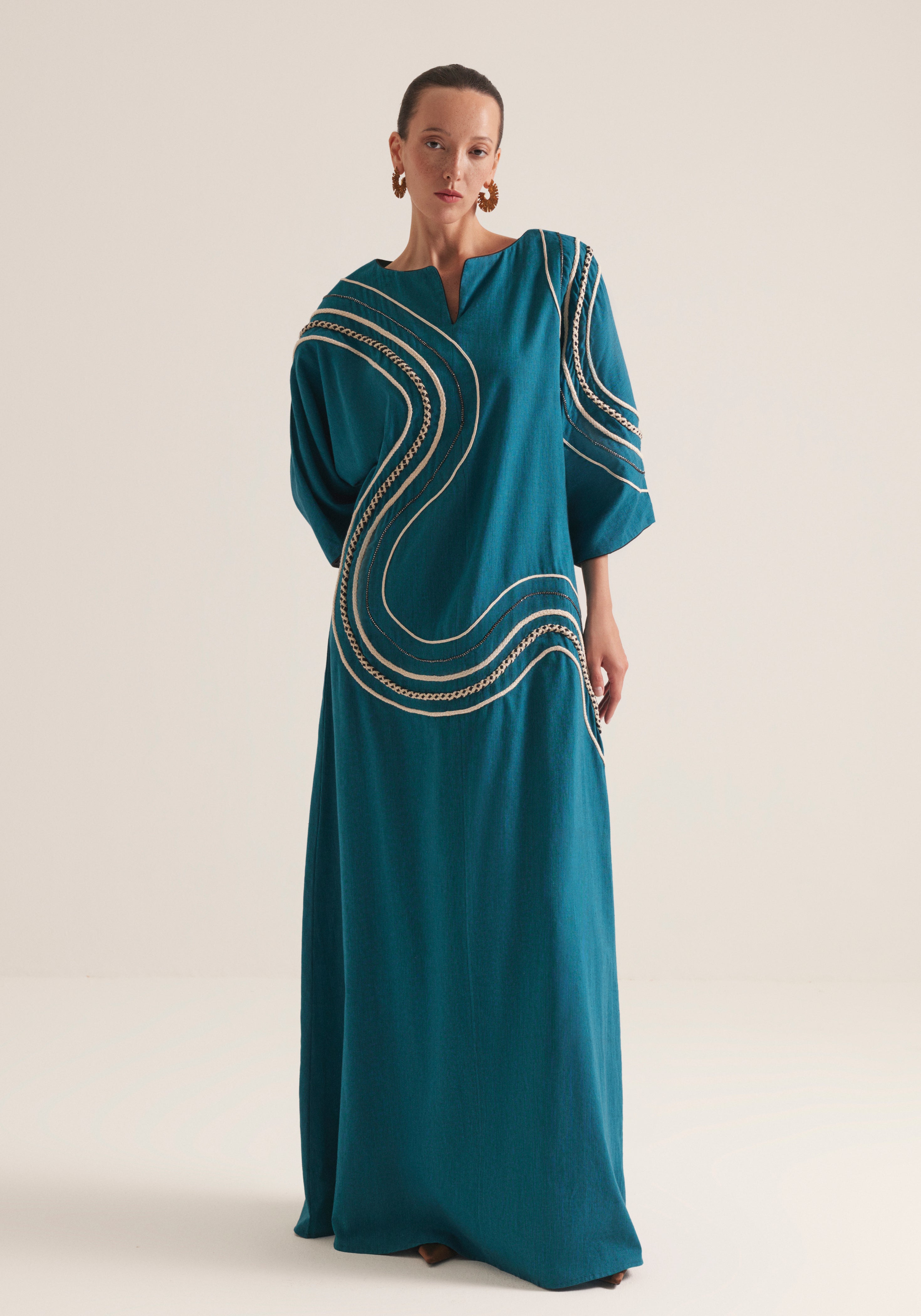 Teal Kaftan with graphic swirls of embroidery