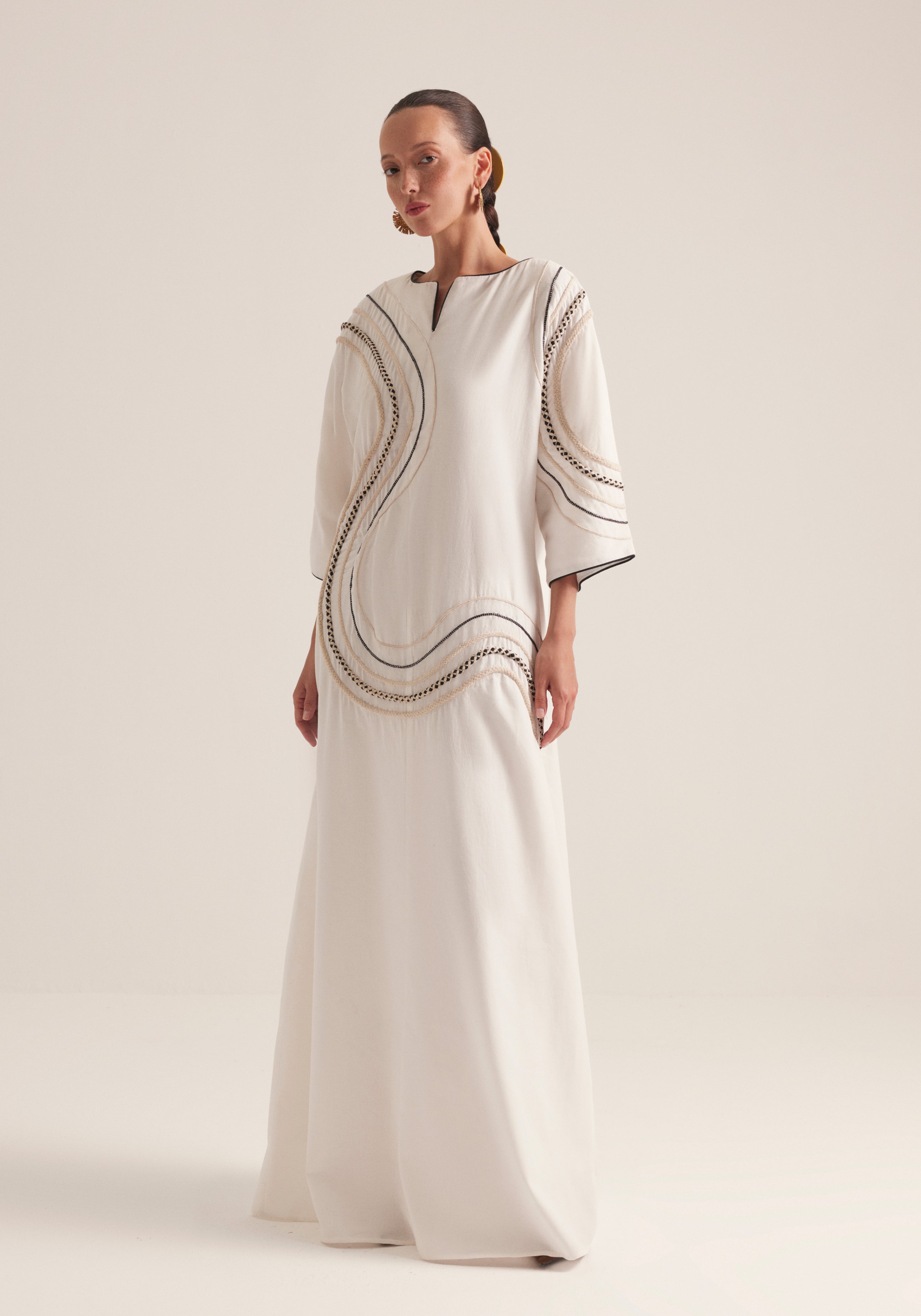 Off white Kaftan with traffic swirls of embroidery
